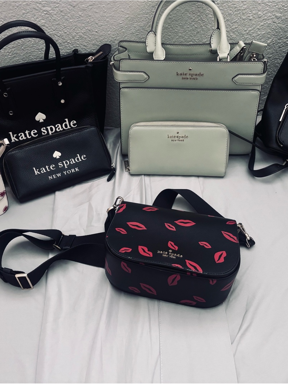 kate spade Black Crossbody with Pink Lip Print